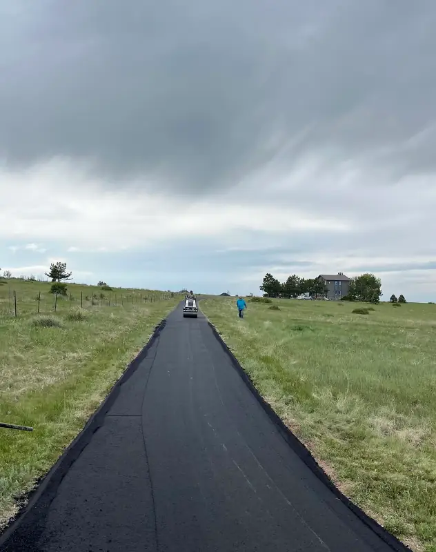 Long asphalt driveway in Ken Caryl being installed